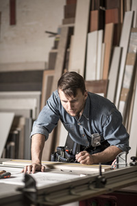 Carpenter making measurements