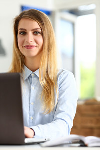 Legal assistant working on a laptop