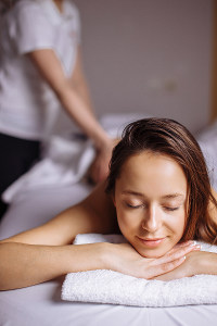 relaxed woman getting a massage