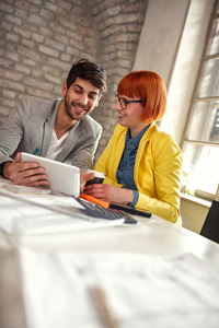 Young professionals working on a tablet